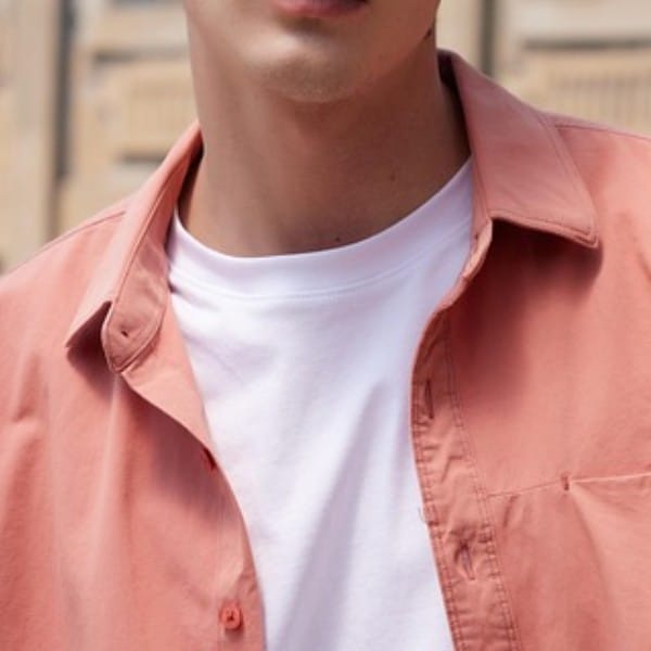 Man wearing a coral overshirt layered over a white tee – casual guys spring outfit