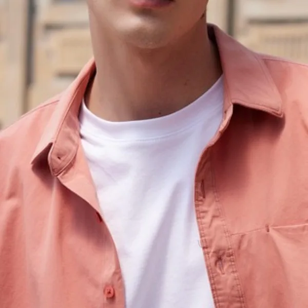 Man wearing a coral overshirt layered over a white tee – casual guys spring outfit