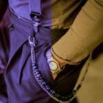 Close-up of men's casual outfit with chain accessory, watch, and suspenders – casual wear for men