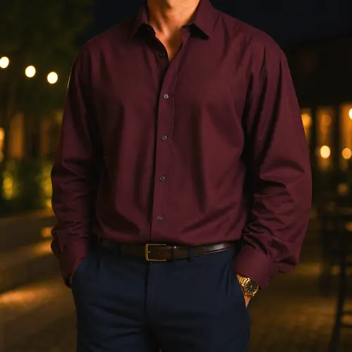 Man wearing a baggy burgundy long sleeve shirt with blue pants showing an oversized fit