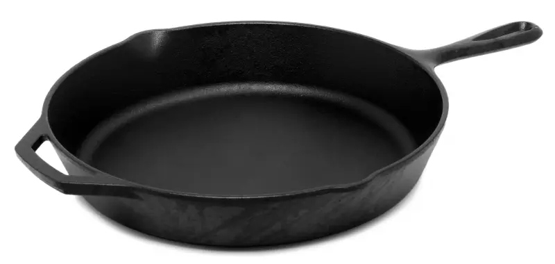 Black cast iron skillet often recommended as the Best Pan for Steak because it holds high heat for a solid sear.