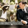 Humorous image comparing an olive green summer suit to a soaked black suit at an outdoor wedding, featuring a raccoon in sunglasses holding a phone.