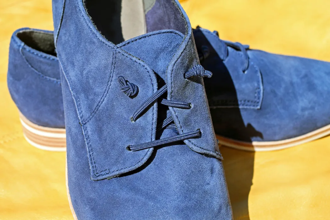 Blue suede dress shoes showing the soft nap discussed in SnazzyGuy’s “Can Suede Shoes Get Wet” guide.