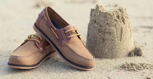 Tan leather boat shoes shown among casual types of men's shoes.