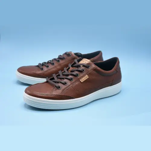 Brown leather low-top sneakers shown among casual types of men's shoes.